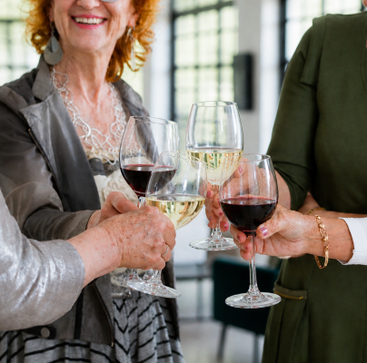 Ladies drinking wine at an Audley event