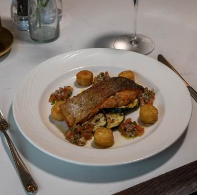 Summer menu - Pan seared sea trout fillet served with grilled courgette, tomato salsa and rosti potato (GF)