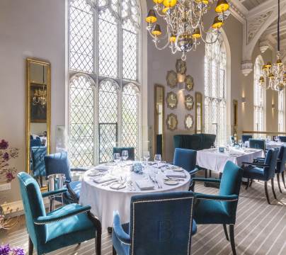 Restaurant tables in grand Victorian dining room