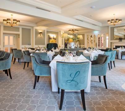 Dining room with monogrammed soft chairs
