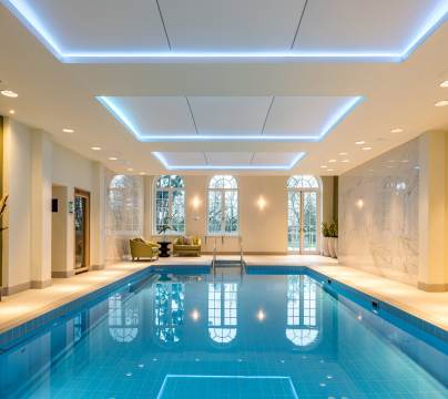 Indoor pool with golden wall art