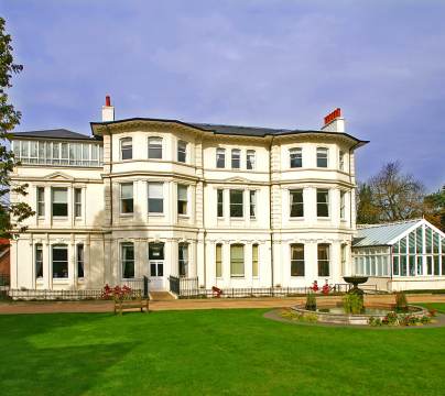 Victorian mansion and grounds with fountain