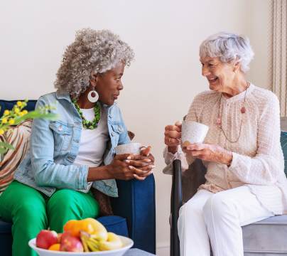 Two women chatting over coffee