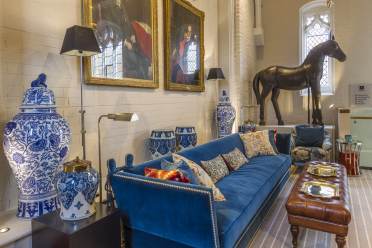 Long comfortable sofa, Victorian parlour styling and large bronze horse