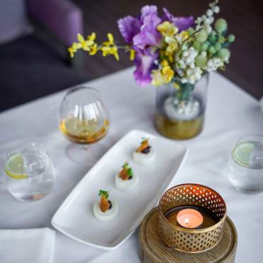 Desserts and digestifs on a white table cloth