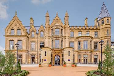 Victorian gothic entrance with towers and turrets