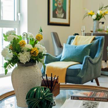 Brightly lit sitting room with soft furnishings