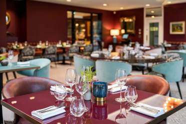 Table at Aldwyn's, Audley Ellerslie's elegant restaurant Table set for dinner