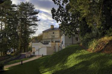Autumn evening at Lind House, Ellerslie retirement village Mansion house seen through trees