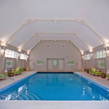 Indoor swimming pool with an arched ceiling