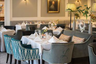 Langton's restaurant at Cooper's Hill, Englefield Green Large table with chairs in a luxury restaurant