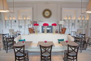 Bistro at The Romney in Audley Mote House, Bearsted Long sofa with bistro tables