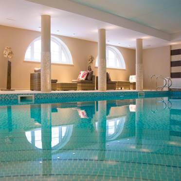Indoor pool with arched windows