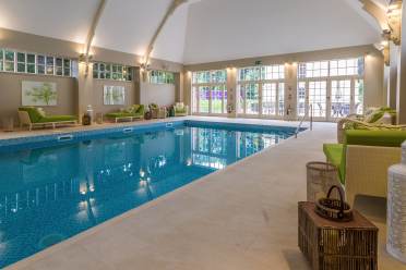Indoor swimming pool with an arched ceiling