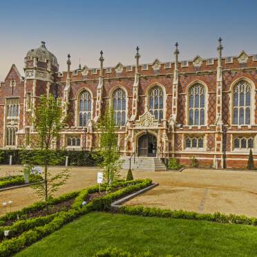 Victorian-gothic hall with arched windows