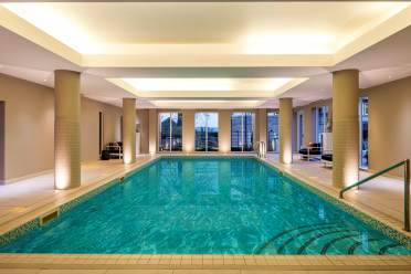 Indoor swimming pool with soft lighting