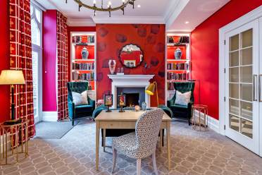 Victorian-style library with red walls