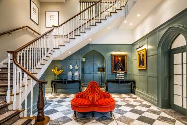 Panelled entrance hall with grand staircase