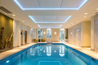 Indoor pool with golden wall art