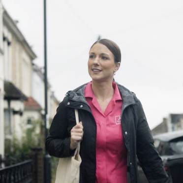 Audley carer walking towards work