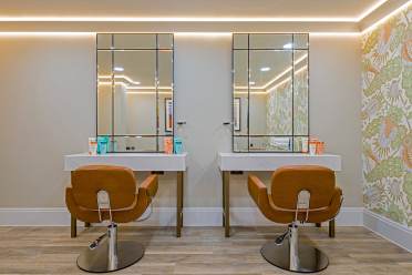 Hair salon, view on the armchairs and mirrors