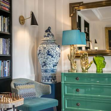 Chinese vase and green drawers with quirky decorations