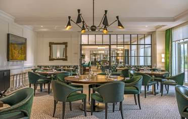 Symonds restaurant at Audley Redwood retirement village Luxury restaurant with green chairs