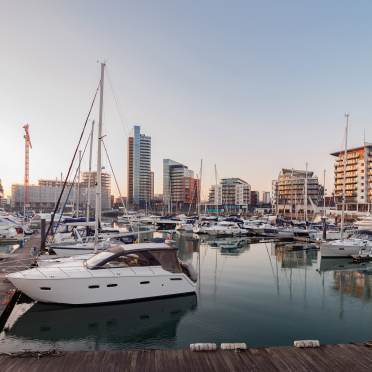 A port with yachts an decking 