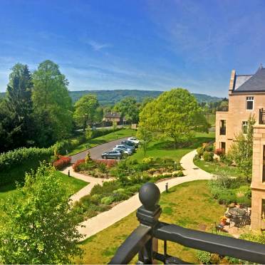 View over the garden from apartment balcony