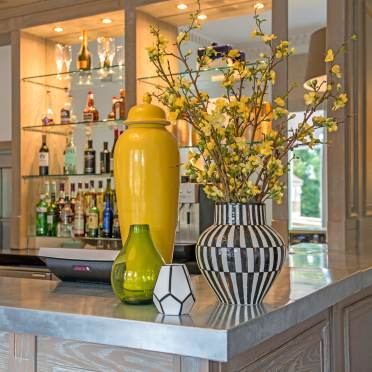 Zinc-topped bar with vases