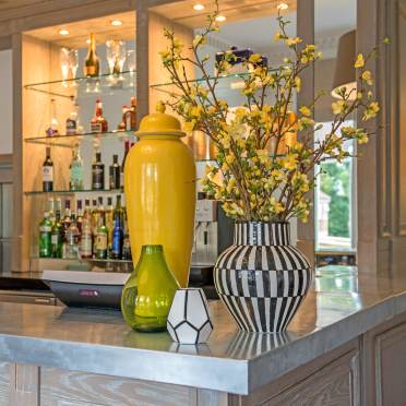 Zinc-topped bar with vases