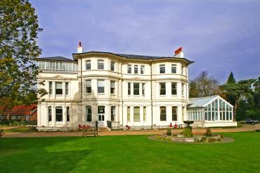 Victorian mansion and grounds with fountain