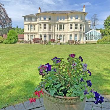 View of main house with pot plant