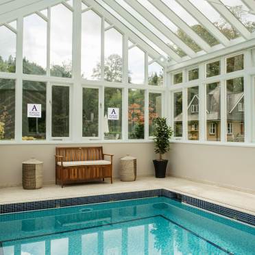 Poolside bench in glazed building