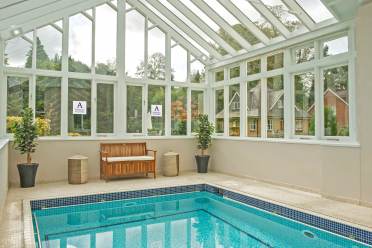 Swimming pool in glazed building