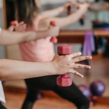 Weights in hands during a fitness class