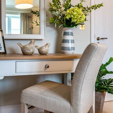 Bedroom vanity with faux flowers