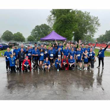 Smiling runners on a rainy day