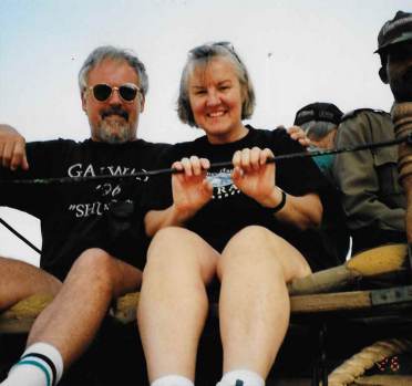 Older couple in seating platform on elephant