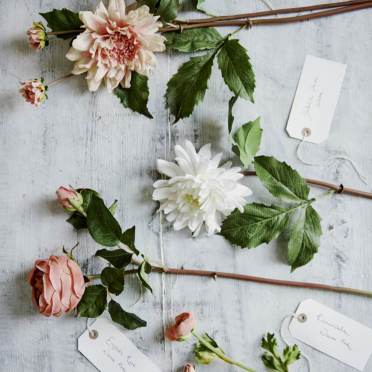 Faux flowers spread on a table top