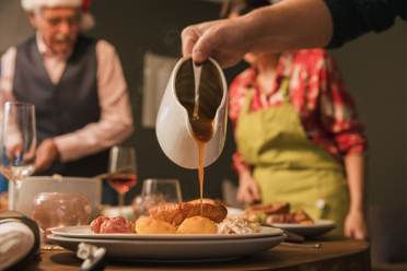 Gravy poured on to a roast lunch