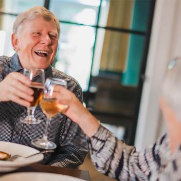 Elderly couple making a toast