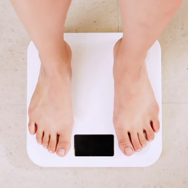 Man's feet on scales