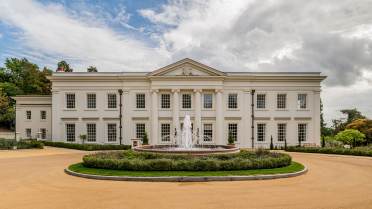 Mansion house with broad drive and fountain