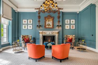 Lounge with chandelier and large fireplace