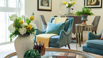 Brightly lit sitting room with soft furnishings