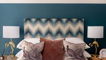 Double bed with soft headboard and cushions