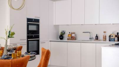 Fitted kitchen with white cupboards