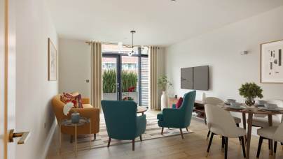Modern living room with wooden floors, featuring a mustard sofa, two teal chairs, a round dining table, and a flat-screen TV. Large window with curtains opens to a view of greenery.
