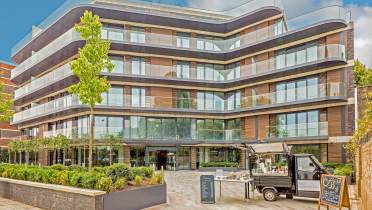 Exterior of a glass building with apartments